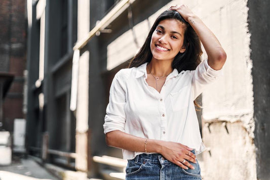 woman wearing white button up shirt